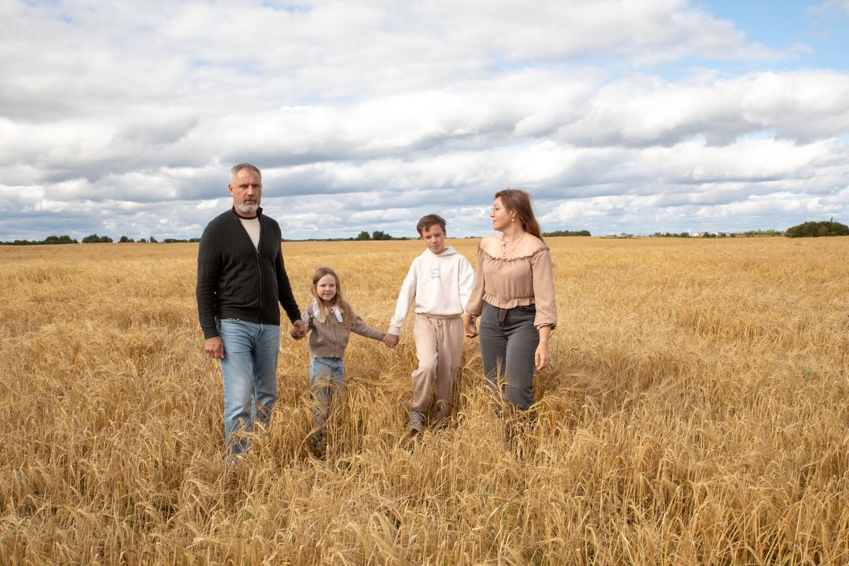 Three generations of a family together on a country path